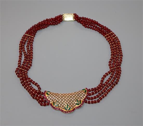 A modern Indian? yellow metal, ruby coloured glass bead, gem and diamond set necklace, 44cm.